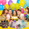 Elegant white and gold drawstring organza bags for gifts, weddings, and parties displayed with balloons and candles