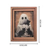 A framed print featuring a white ghost and several black cats against a muted background.