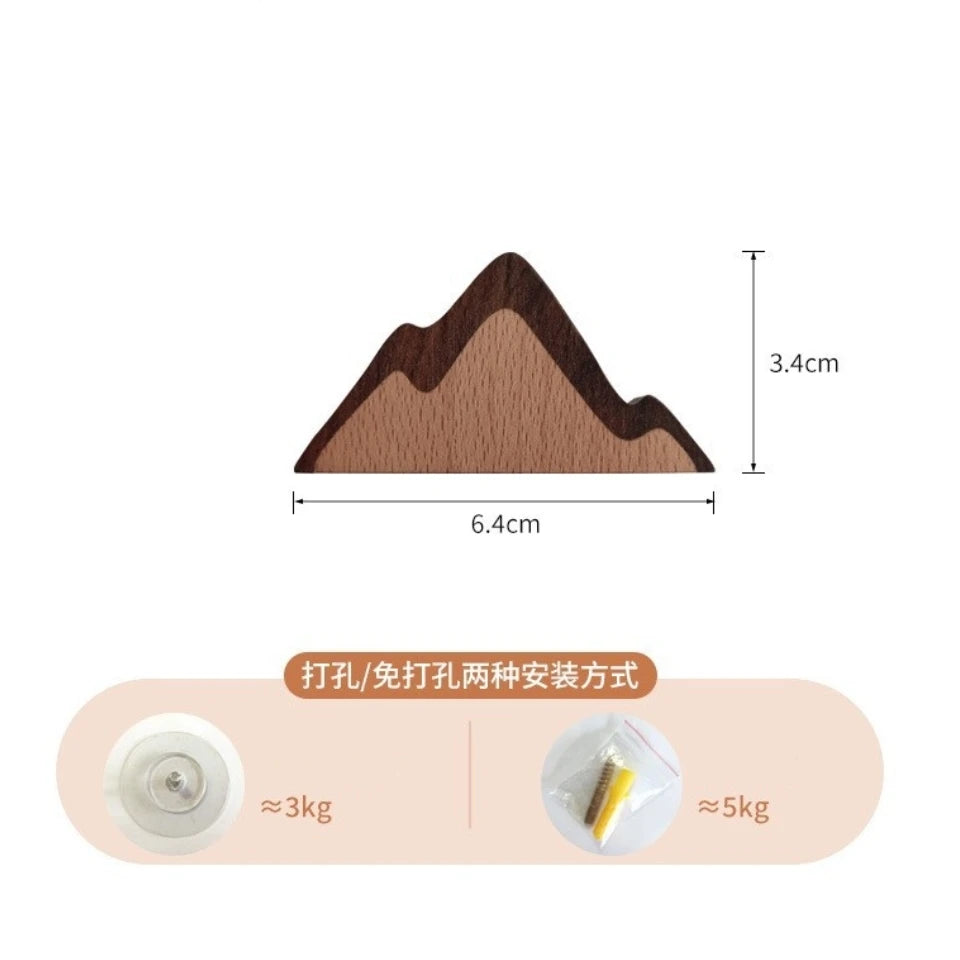 A wooden animal hook shaped like a mountain, showing its dimensions and weight.