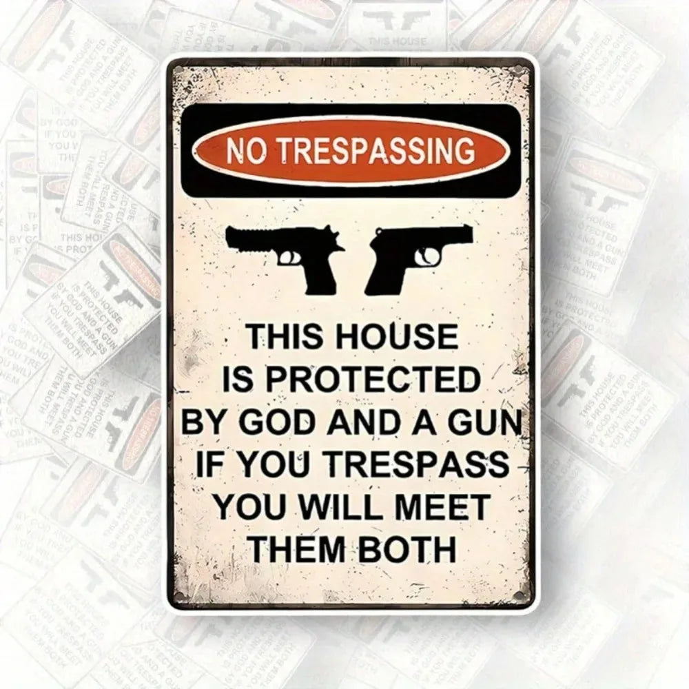 Rustic metal wall art sign with 'No Trespassing' text and silhouettes of guns.