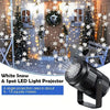 A black LED light projector casting white snowflake patterns onto a snowy outdoor scene.