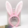 Pink fluffy bunny ear headbands displayed in a white photo frame