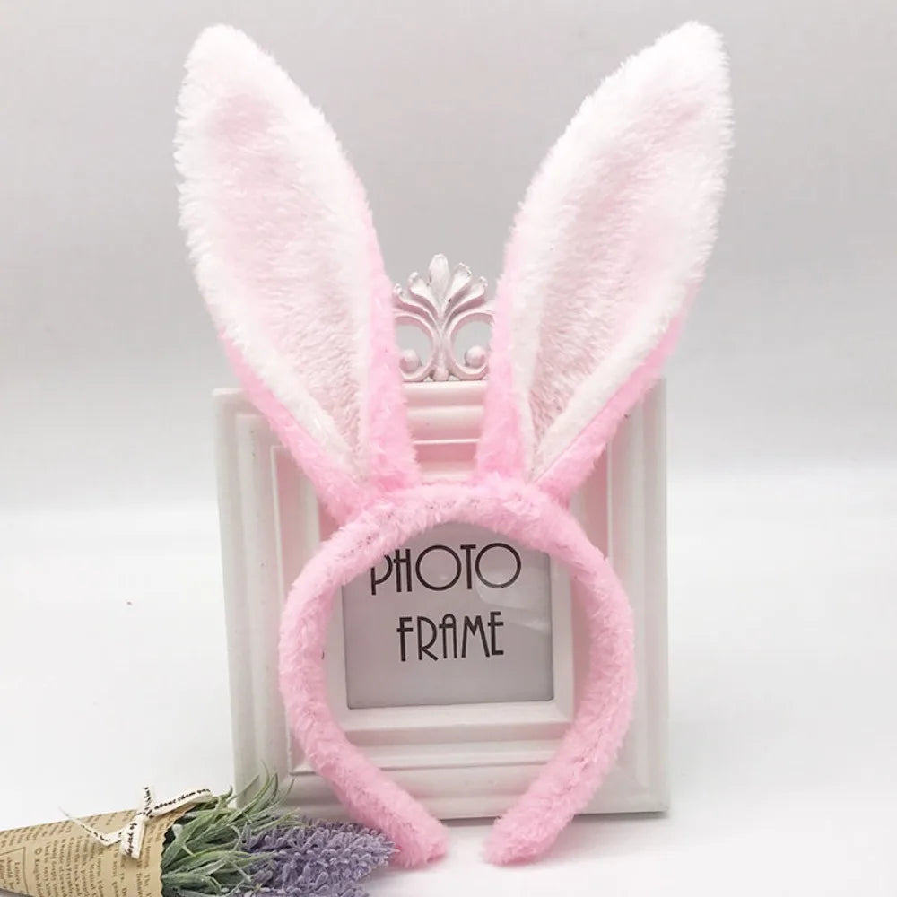 Pink fluffy bunny ear headbands displayed in a white photo frame
