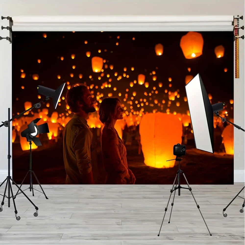 A banner featuring a dark background with numerous glowing orange lanterns and two people looking towards the lights.