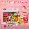 A pink gift box containing two bottles of Dragonfruit and Golden Citrus moisturizing hand sanitizer spray with various fruit 