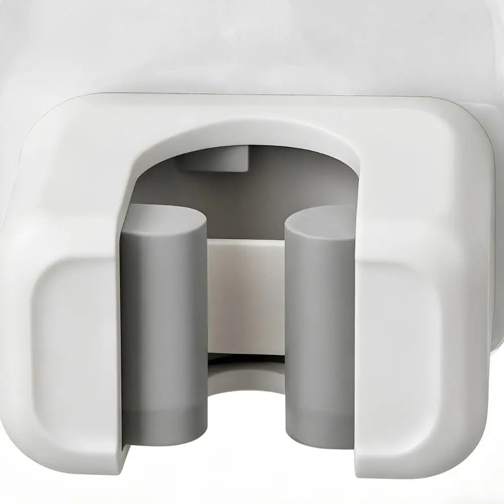 A white plastic holder designed to store and organize long-handled tools like mops or brooms.