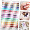 A sheet of glitter gems in a rainbow gradient for facial tattoos