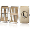 An open leather case displaying an 8-piece stainless steel manicure and pedicure kit with various tools.