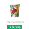 A paper cup featuring a vibrant tropical floral pattern of pink, yellow, and green leaves.