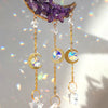 Handcrafted moon crystal suncatcher featuring purple crystals and gold prism pendants