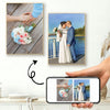 A custom photo canvas print featuring a couple standing by water, framed next to a hand holding a bouquet of flowers.