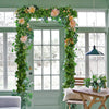 Artificial ivy vine garland framing a doorway in a light green room