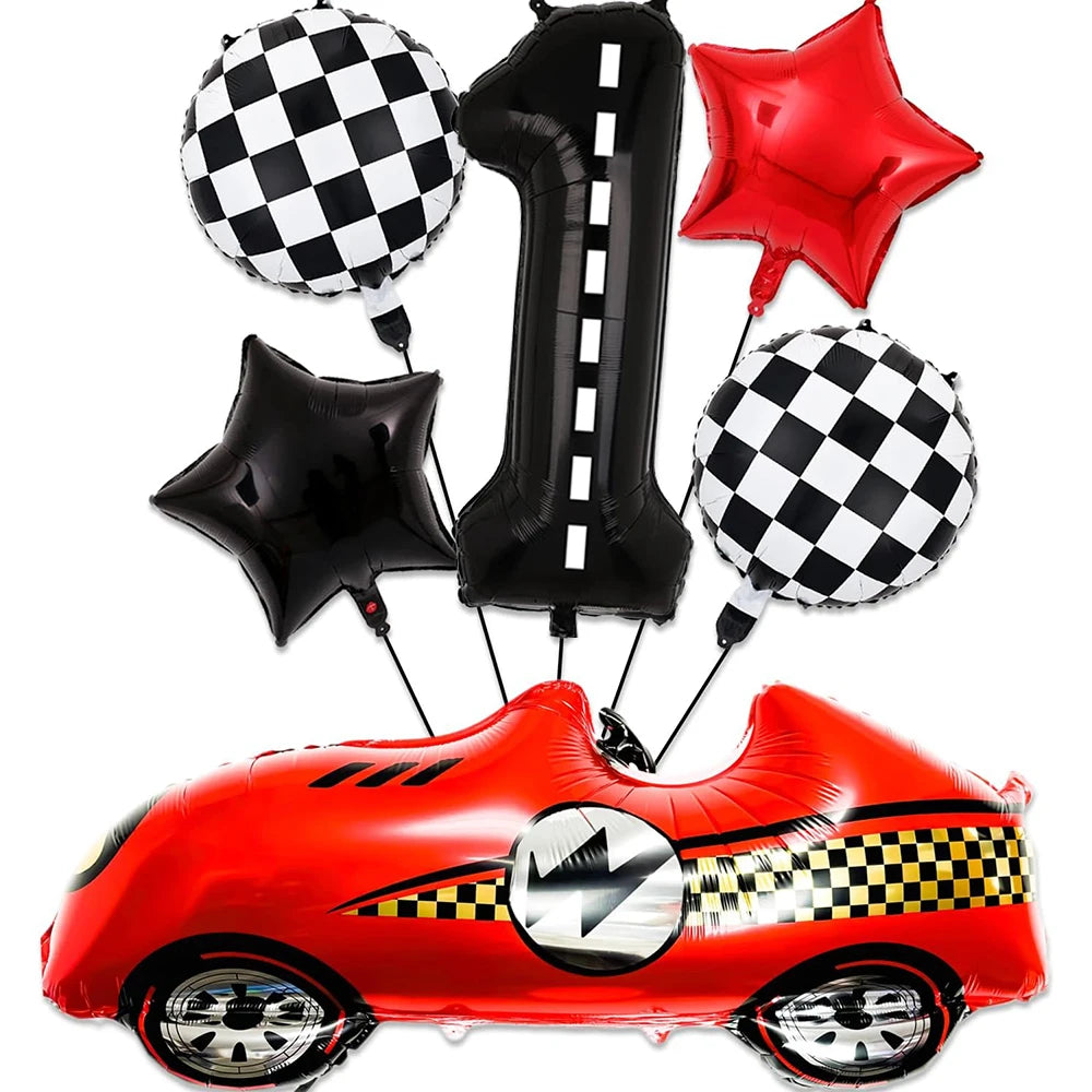 A set of red race car shaped balloons, including a car, a number one balloon, and a checkered pattern balloon.