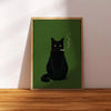 A framed poster featuring a black cat smoking, set against a dark green background.