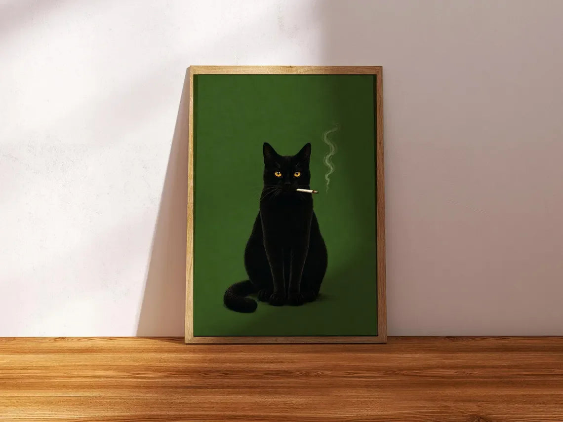 A framed poster featuring a black cat smoking, set against a dark green background.