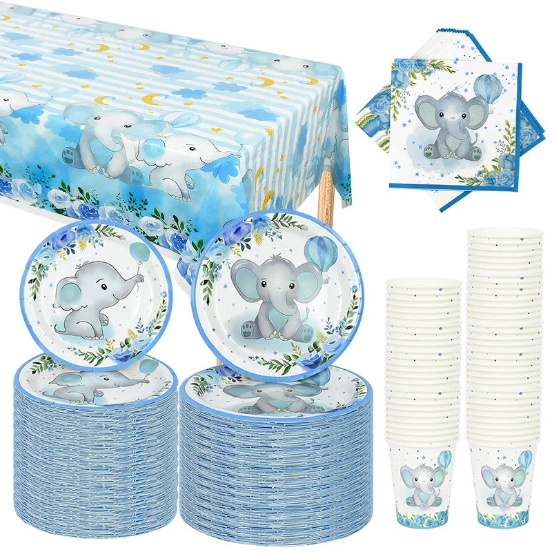 A set of blue and white cartoon elephant disposable party tableware including a tablecloth, plates, and cups.