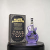A glass whiskey decanter shaped like a guitar, featuring the Black Sabbath Paranoid whiskey label.