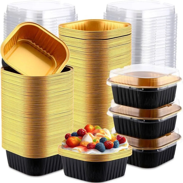 Stack of square aluminum foil baking boxes with transparent lids in gold and black.