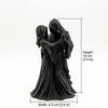 A dark romantic sculpture of a Gothic Grim Reaper couple embracing, shown in profile.