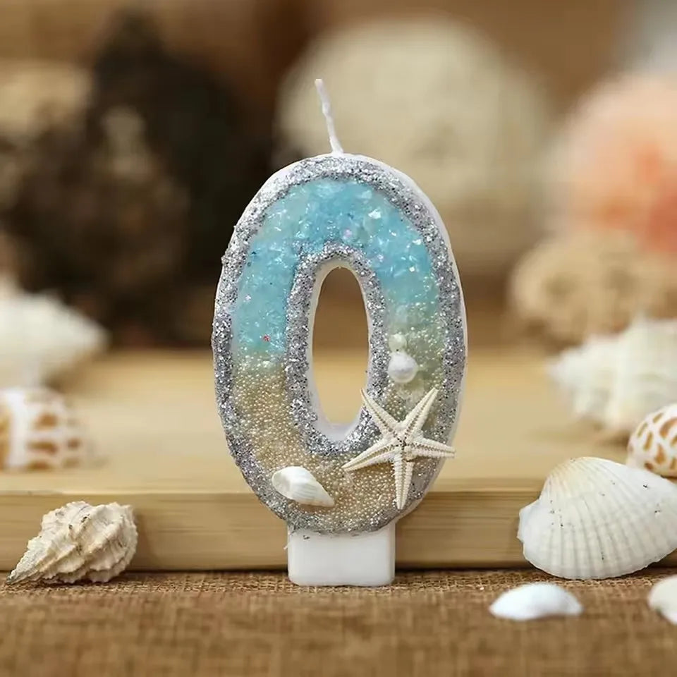 Glitter number zero cake topper with a starfish design on a white background