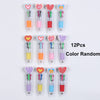 A collection of 12 heart-shaped multicolor ballpoint pens in various colors and designs.