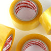 Roll of yellow heavy-duty transparent packing tape with a red and white striped core visible.