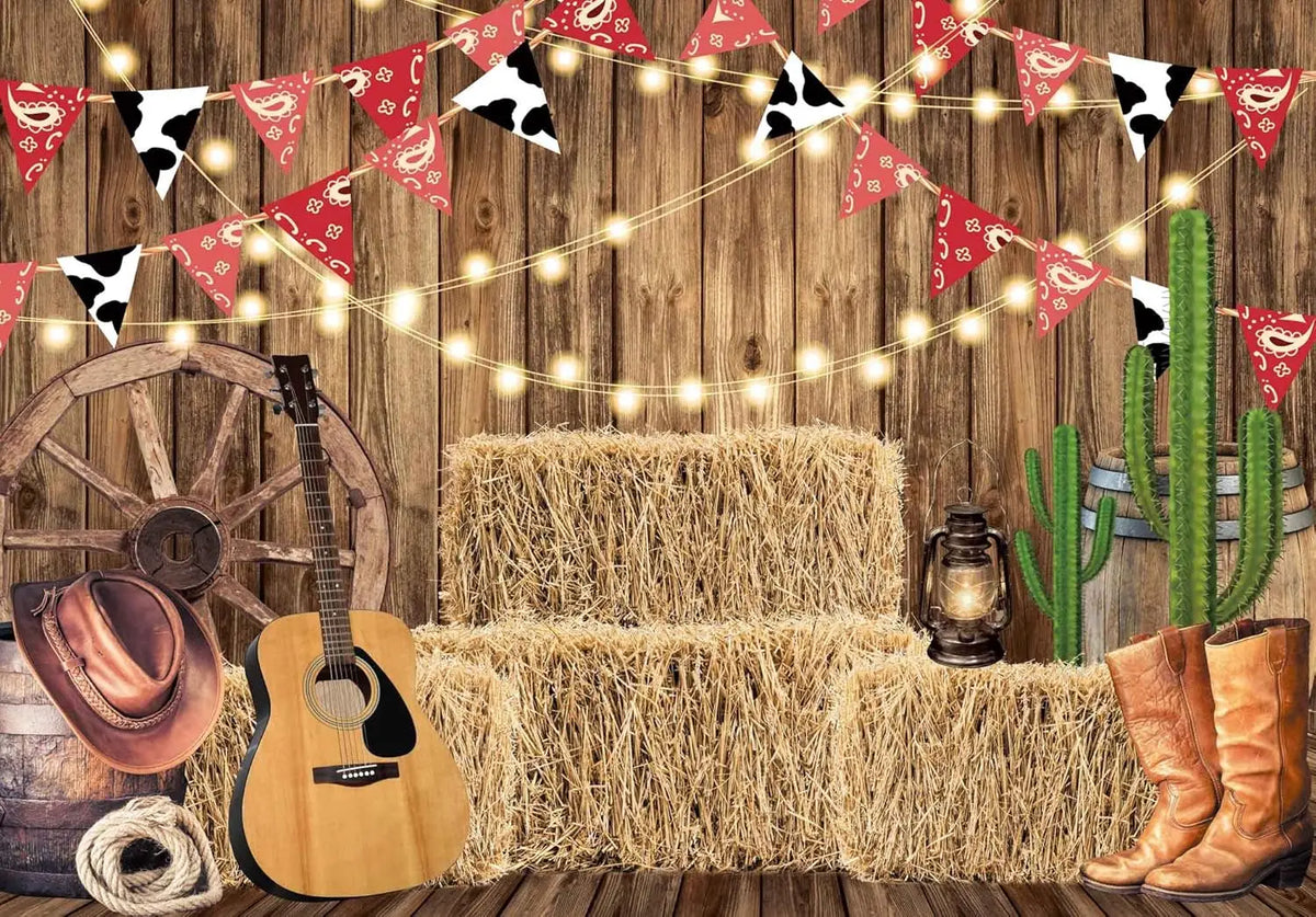 A rustic western backdrop featuring a wooden guitar, hay bales, and decorative pennant banners.