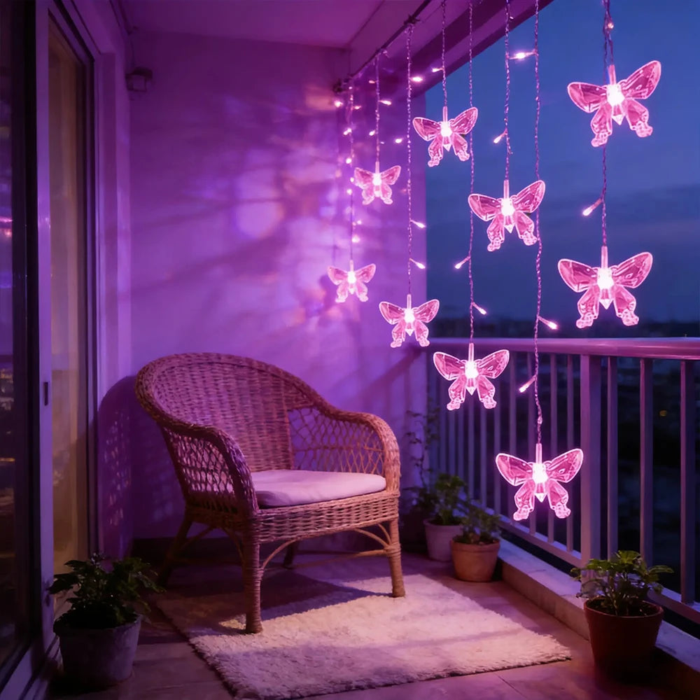 LED butterfly curtain lights hanging in a purple-lit balcony setting