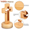 A handcrafted wooden cross standing ornament with a smooth surface and rounded corner design.