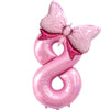 Pink foil balloon shaped like the number 8 with a bow decoration