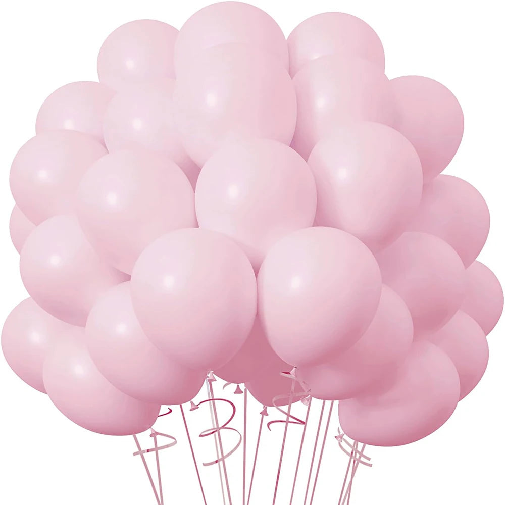 A bouquet of pink latex balloons tied together with strings.