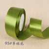 Roll of olive green silk satin ribbon for gift wrapping and craft projects