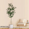 A tall artificial olive tree in a cylindrical pot displayed against a light wall.