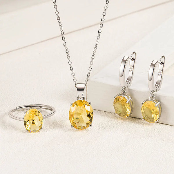Sterling silver zircon jewelry set featuring a pendant necklace and matching hoop earrings