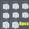 Eight white wall mounted holders for storing mops and brooms