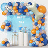 A balloon garland featuring dog paw and bone shapes in blue, orange, and beige colors for a birthday party decoration.