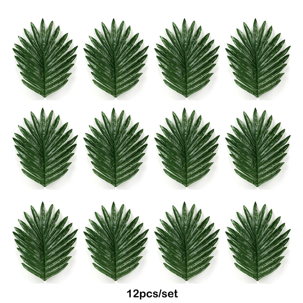 Twelve artificial tropical palm leaves in various shades of green for party decor