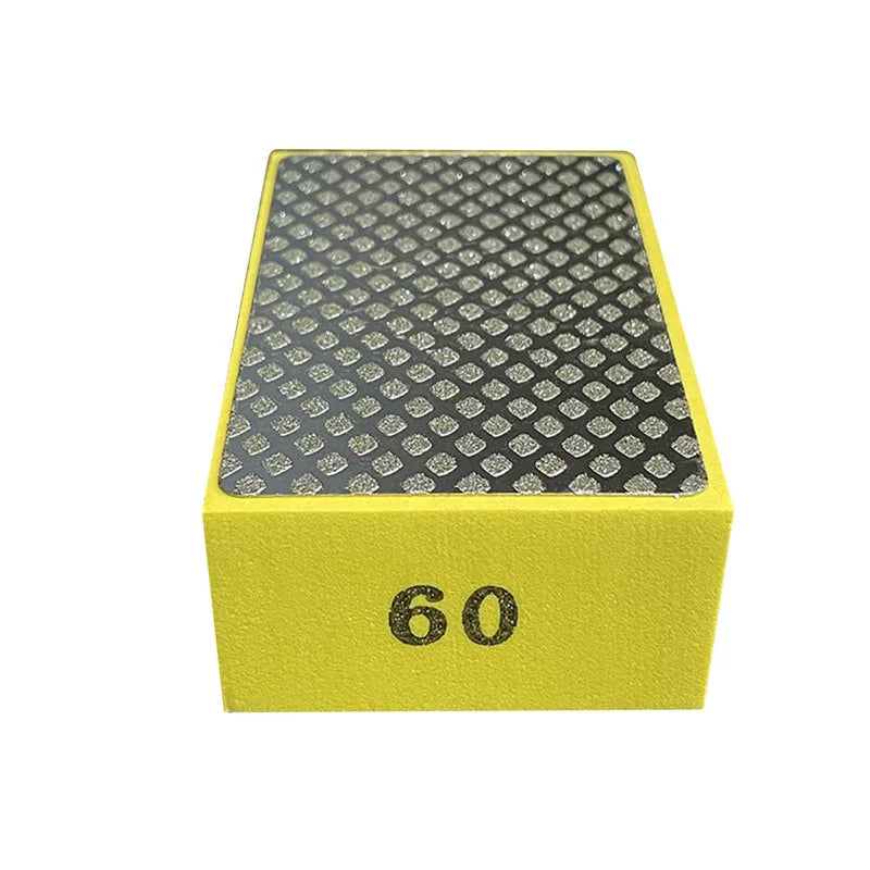 A yellow rectangular polishing pad with a black diamond-patterned surface and the number 60 printed on the side.