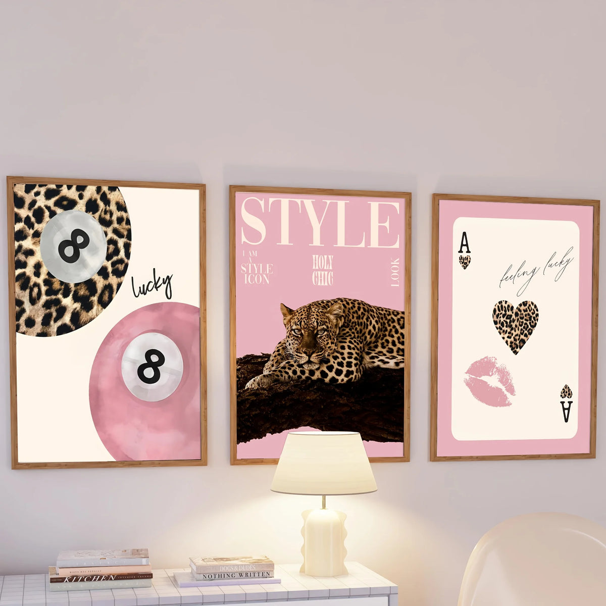 A set of three framed canvas wall art pieces featuring leopard and cheetah prints in pink and gold tones.