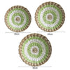 Three circular bohemian straw wall decor hangings of increasing size, featuring concentric rings of natural and light green f