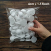 A hand holds a clear plastic bag filled with white polystyrene foam balls for crafting and decorating.