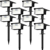 Two black solar powered motion sensor spot lights mounted on poles.