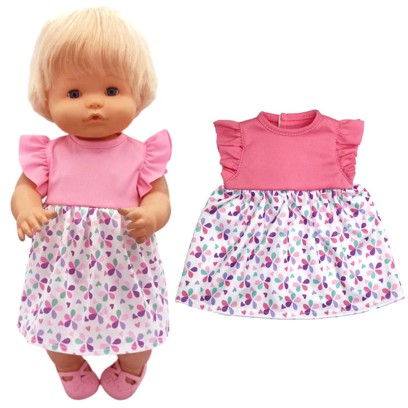 A blonde doll wearing a pink ruffled top and a white and purple floral skirt.