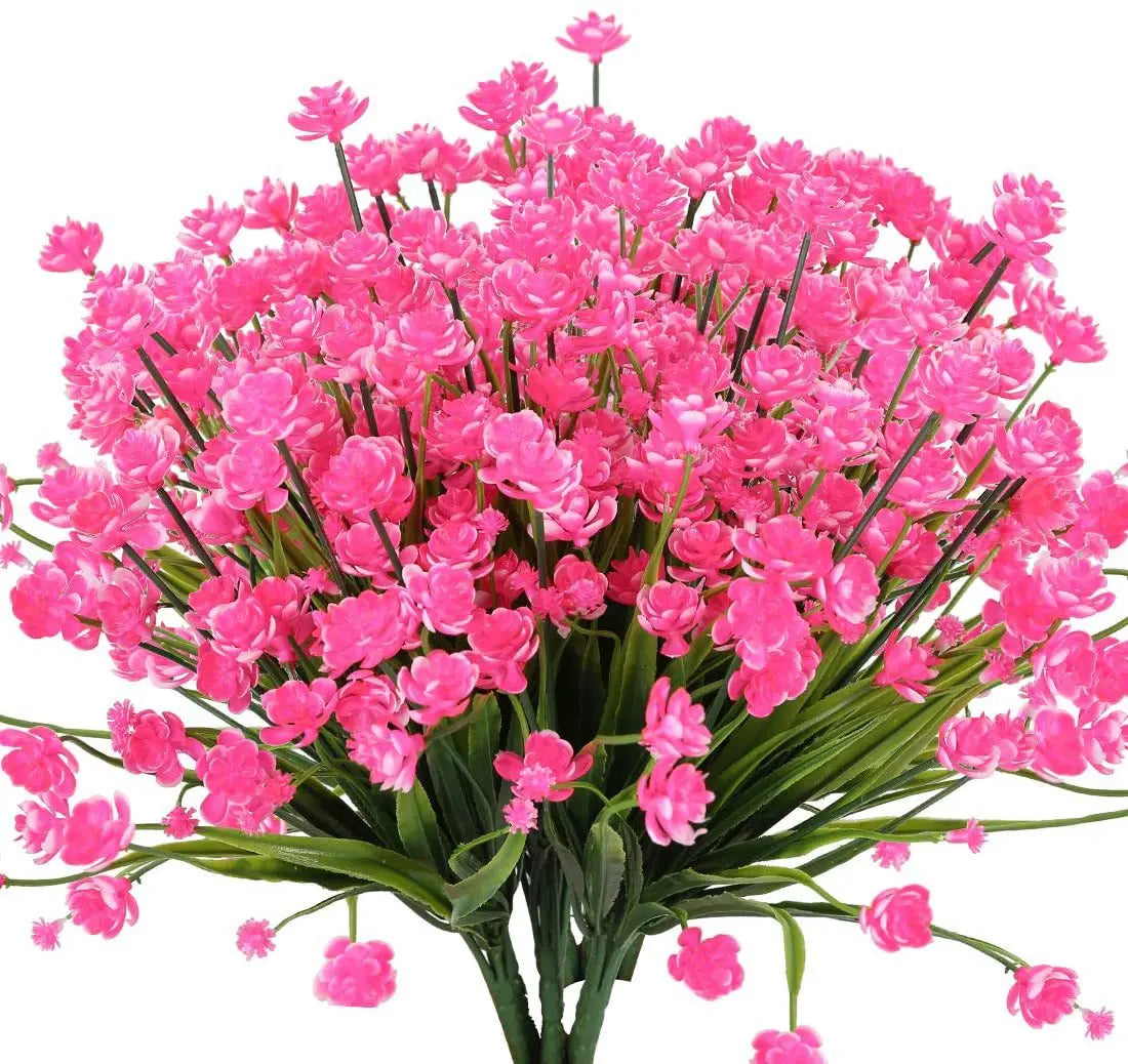 A vibrant bouquet of pink flowers, likely artificial greenery, bundled for home or event decor.