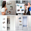 A display showing magnetic picture frames on a refrigerator door and inside cabinet doors.