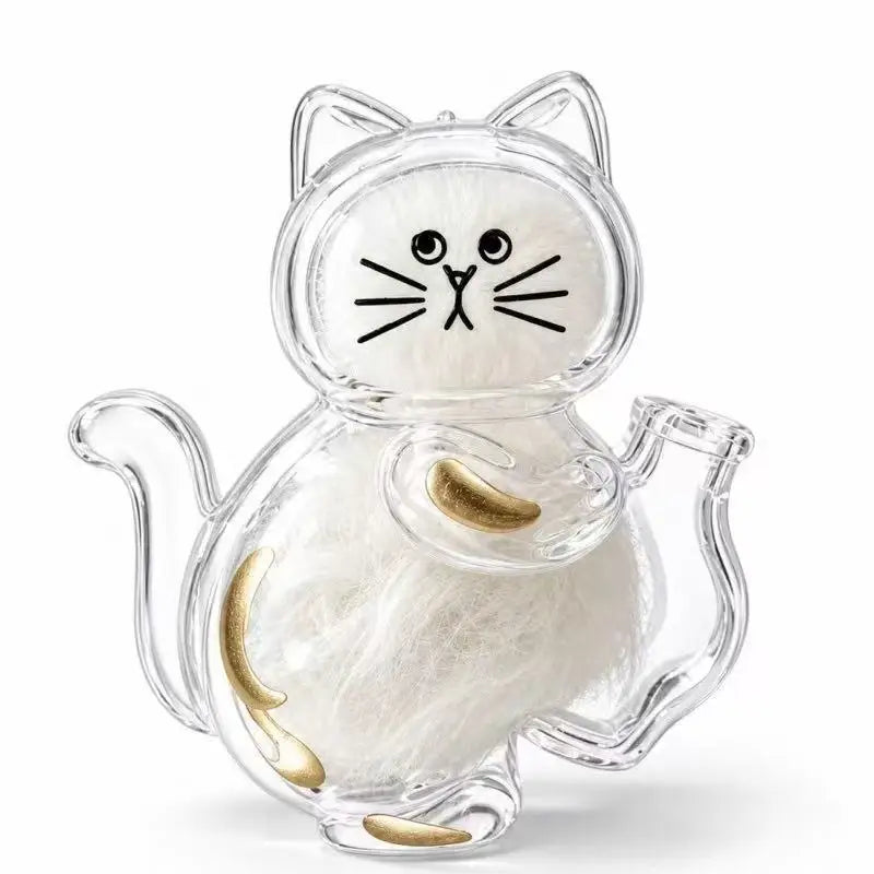 A clear capsule cat whisker keepsake magnet with white fur and gold accents.