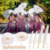 A group of women in purple dresses holding white oil paper umbrellas with gold handles.
