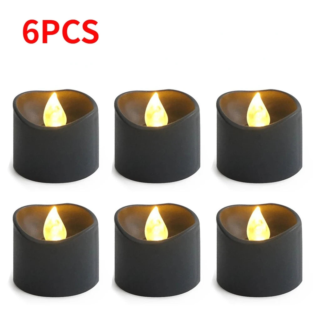 Six pieces of black flameless LED candles with a warm white glow