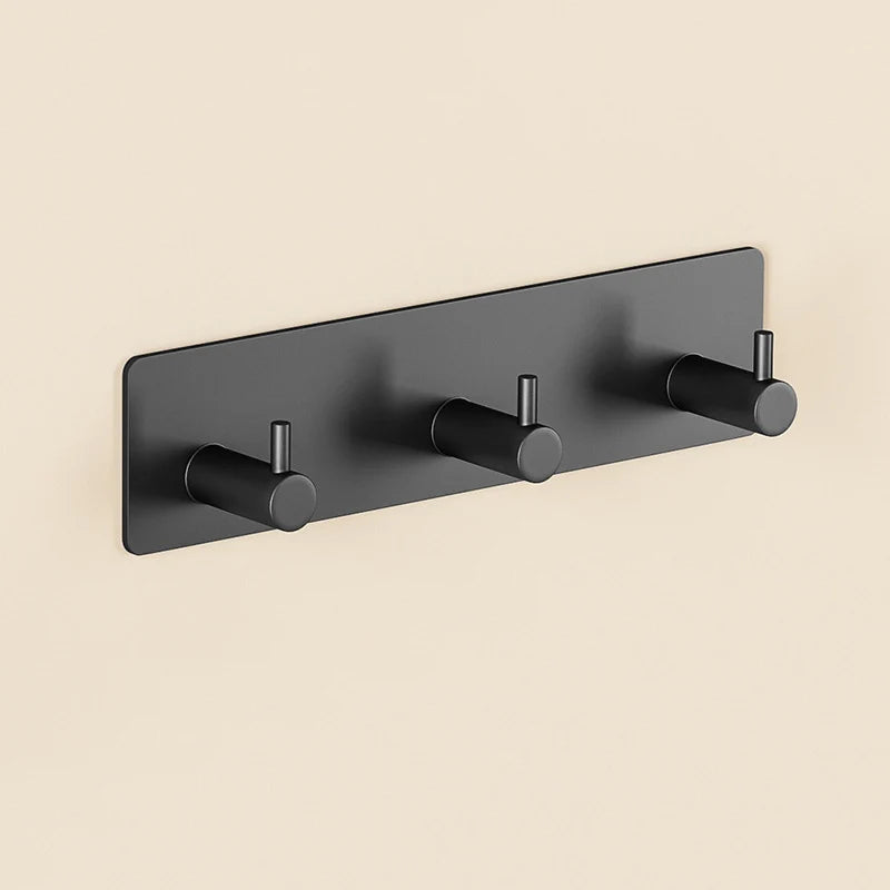 A dark gray extra thick self-adhesive wall hook designed for hanging keys and jewelry.