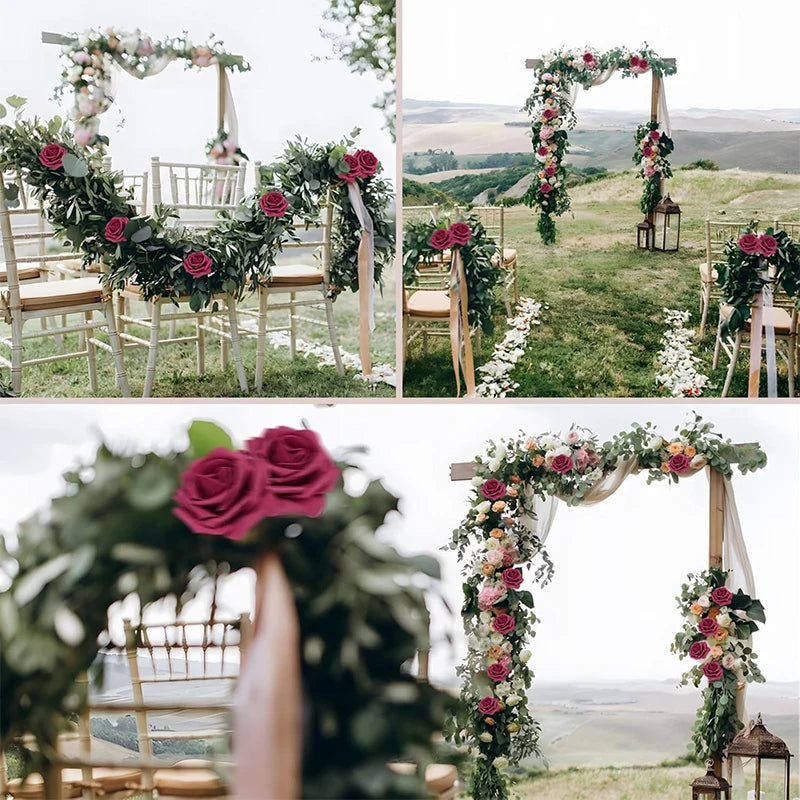 A close-up of a floral archway decorated with pink and red roses and greenery for a wedding backdrop.